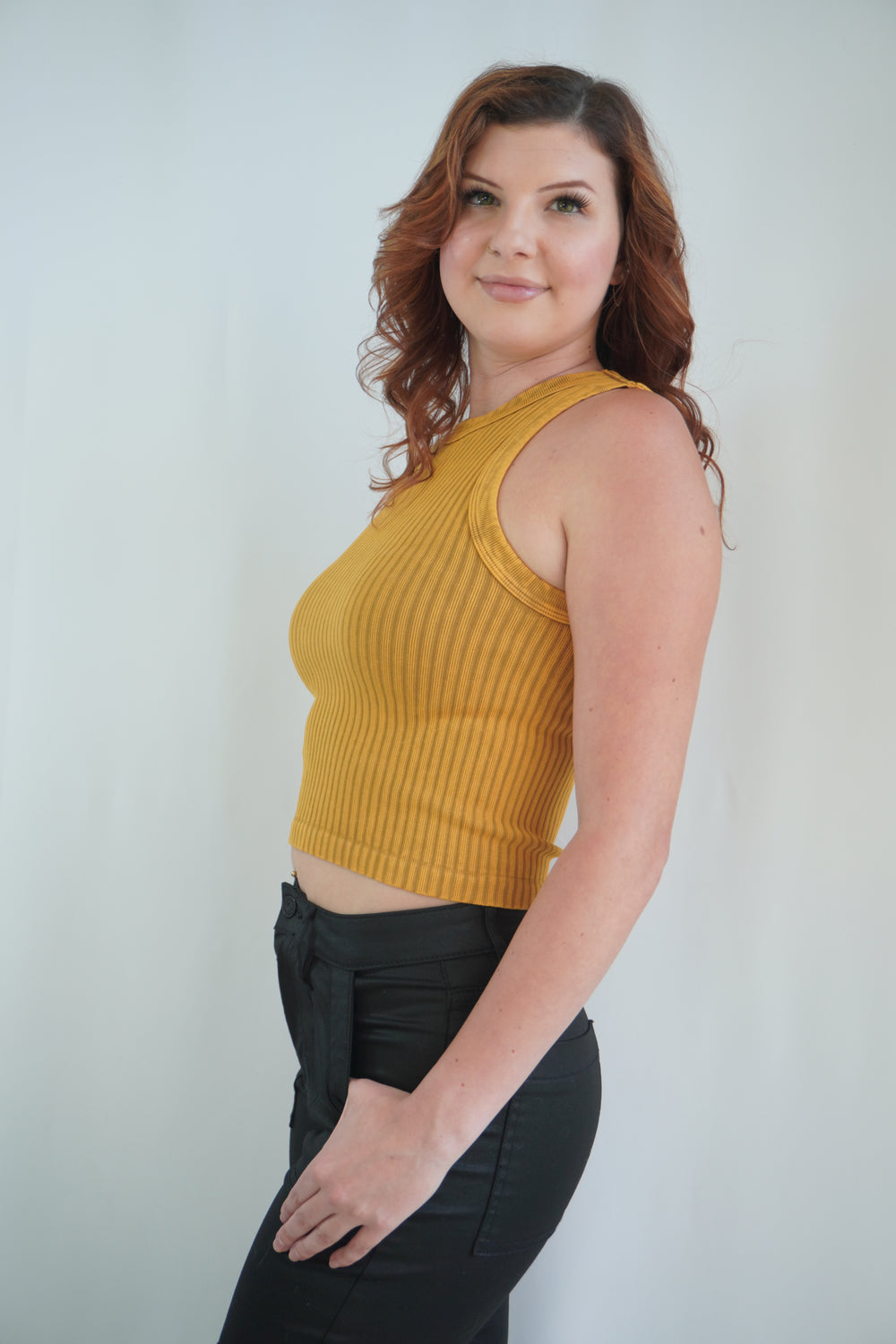 Sleeveless ribbed high-neck crop tank in warm vintage nugget color