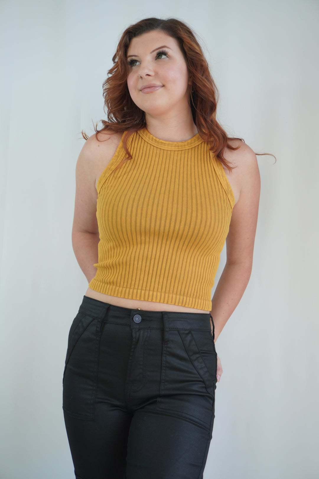 Sleeveless ribbed high-neck crop tank in warm vintage nugget color