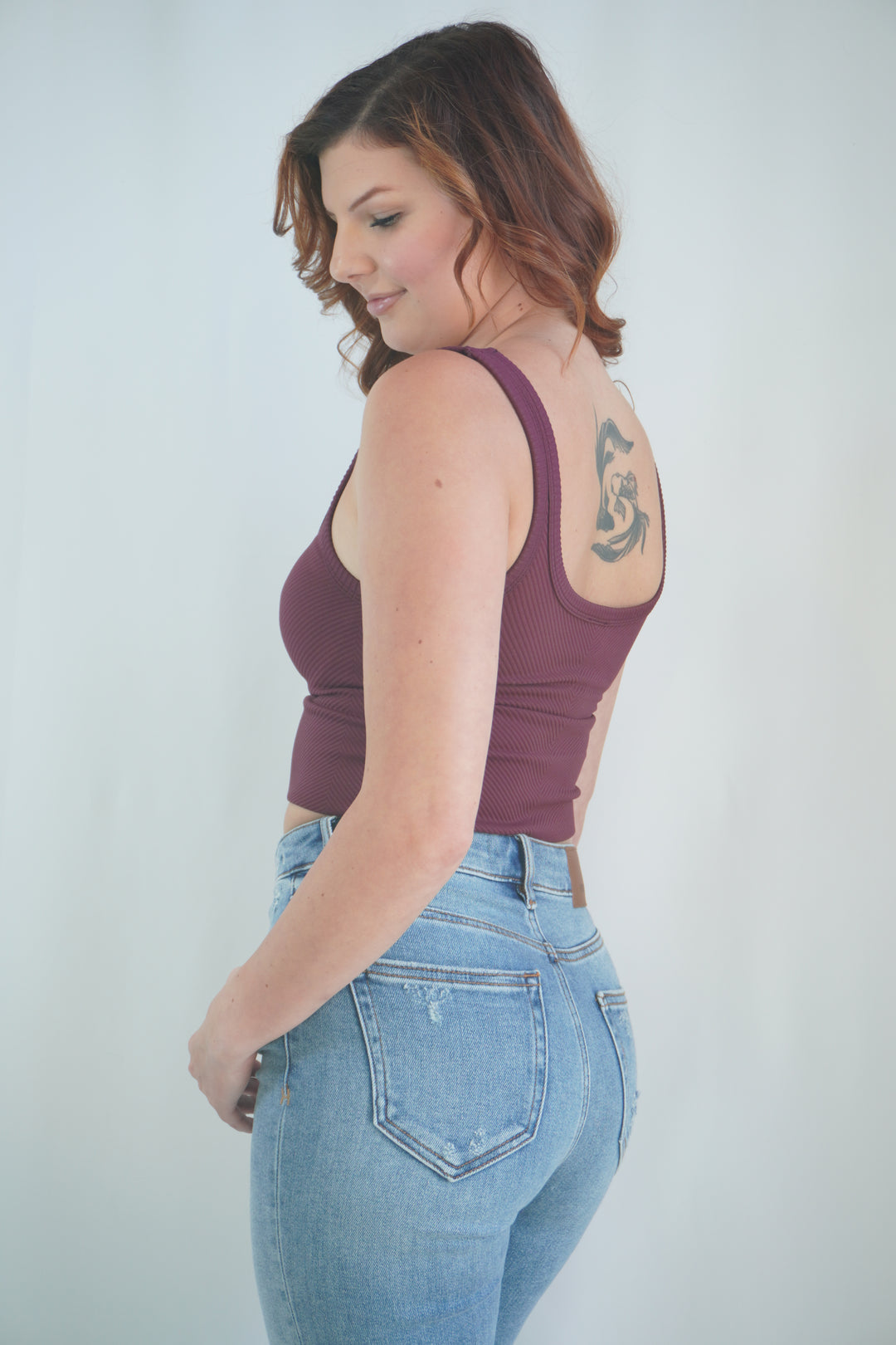 Side view of cropped fig tank with thick shoulder straps