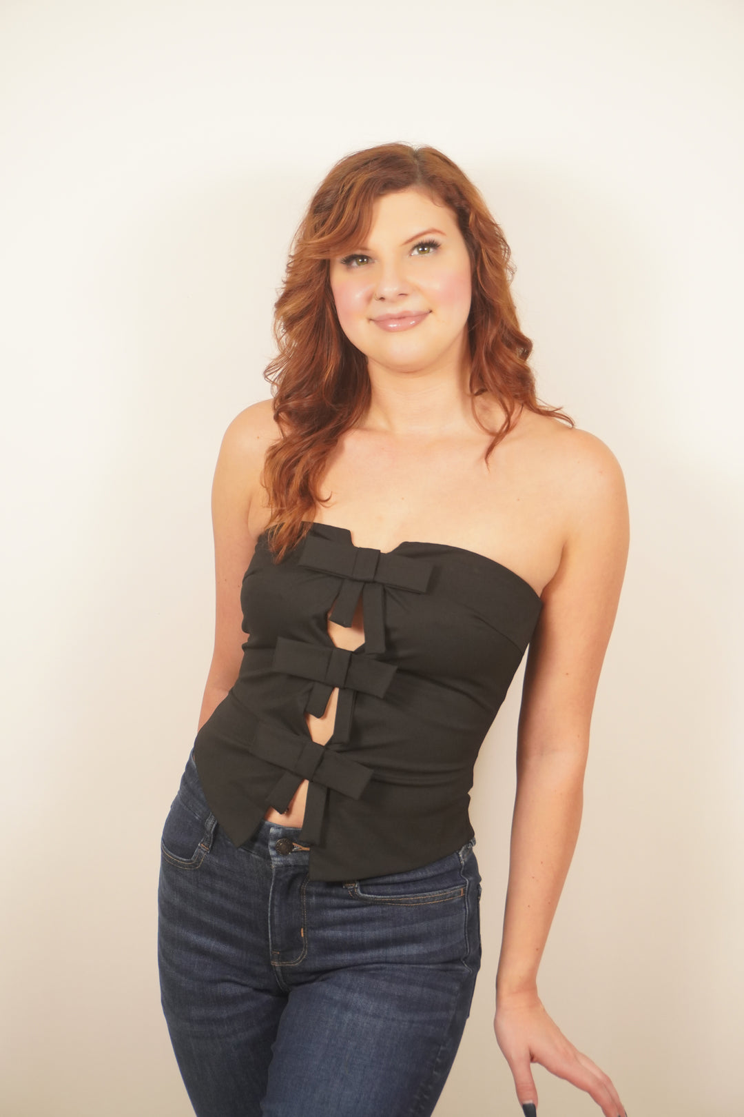 Bow Envy Strapless Top highlighting the strapless design and bow detail