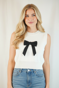 Front view - blonde model in bow sleeveless sweater