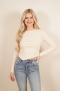Front view - blonde model in cream ruched knit top